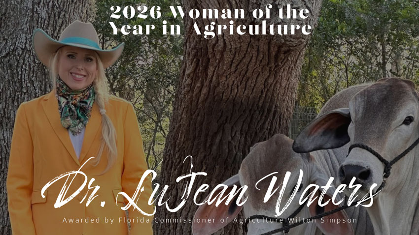 2026 Woman of the Year in Agriculture Dr. LuJean Waters, a smiling woman standing under a tree next to two cows