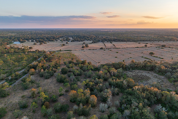 An aerial view of ranch at sunset