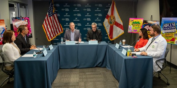 Commissioner Simpson, lawmakers and experts having a roundtable discussion