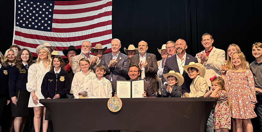Governor Ron DeSantis, Commissioner Simpson and others celebrate the signing of the Farm Bill.