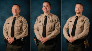 Three law enforcement officers in uniform