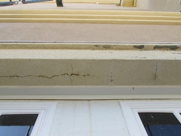 Cracked stucco on the exterior of a home