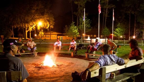 Picture: People sit around a campfire