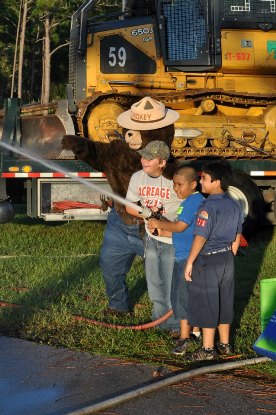 Smokey Bear With Kids and Fire Hose